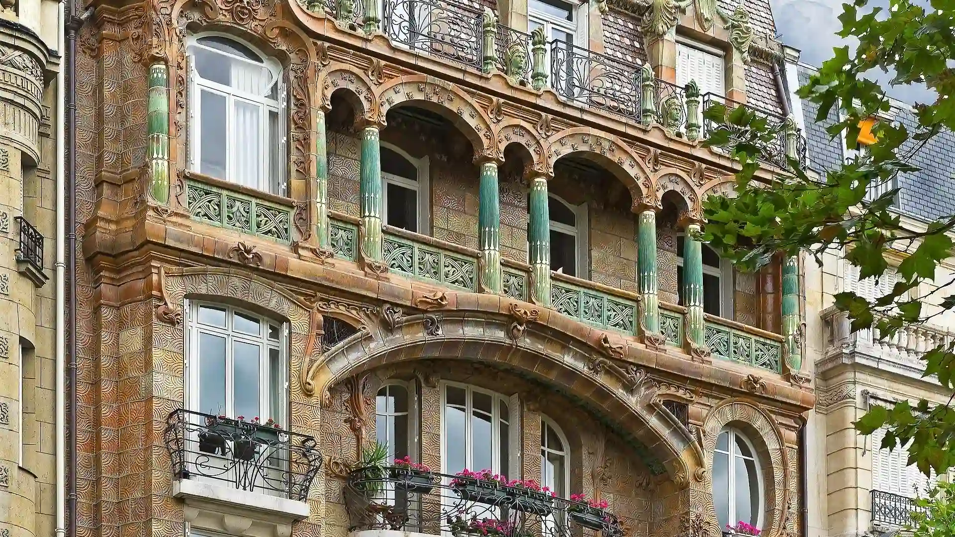 An elegant building adorned with elaborate balconies and windows, highlighting its ornate design and craftsmanship