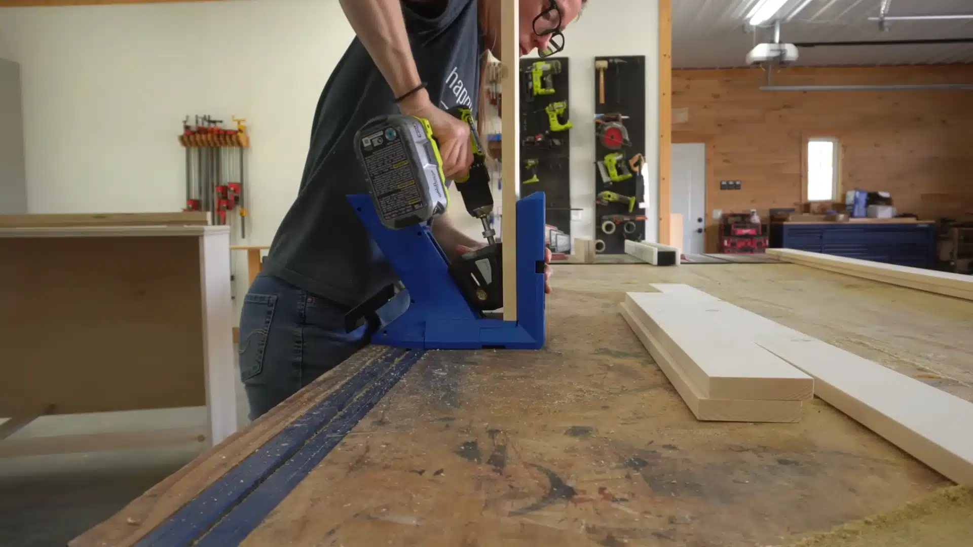 Drilling pocket holes into wooden boards using jig for second foldout frame with support legs
