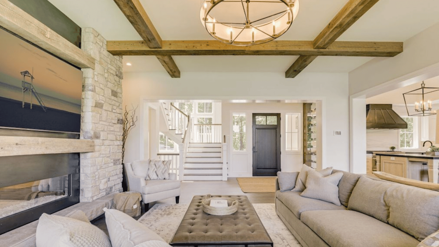 coastal living room with exposed reclaimed wood beams across the ceiling